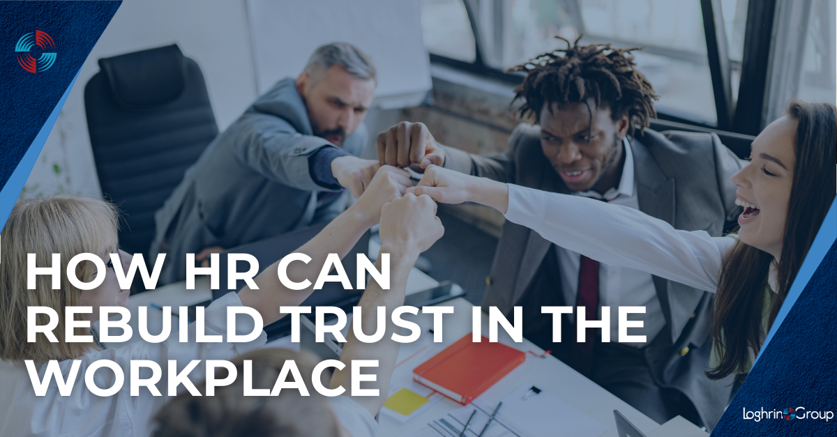 A team leans in around a table, touching fists to symbolize teamwork and trust. Text reads: “How HR Can Rebuild Trust in the Workplace.”